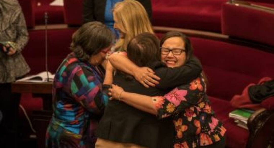 Emotional scenes in the upper house after the voluntary assisted dying laws passed. Photo: Jason South