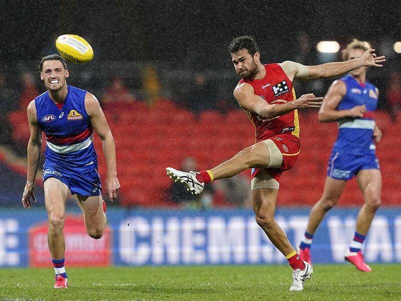 Gold Coast's Jarrod Harbrow in action against his former AFL side the Western Bulldogs.