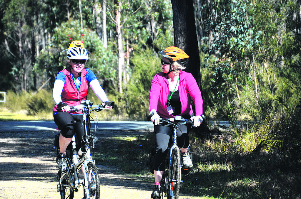 FUN ON TWO WHEELS – Socialising goes hand in hand with cycling on this rail trail ride. Photos: Karen Graham.