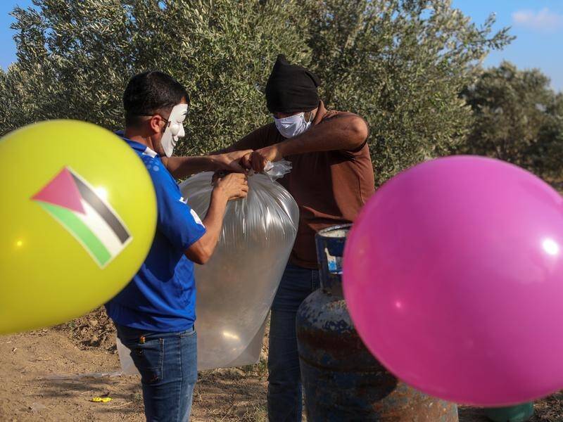 Incendiary balloons launched from Gaza have prompted a retaliatory Israeli strike.