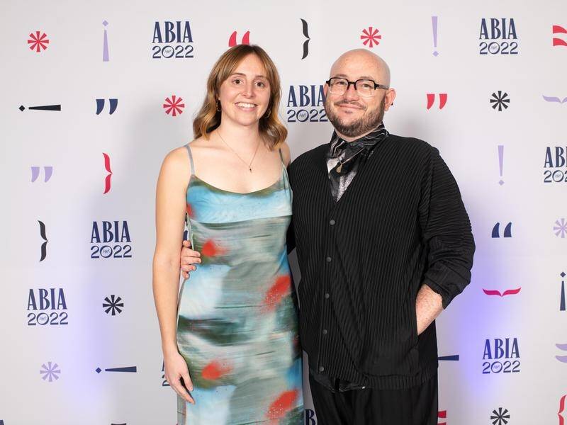 Diana Reid, shown with publisher Robert Watkins, won ABIA's book of the year.