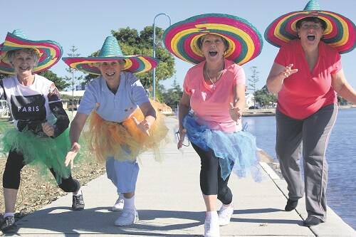 READY FOR A GOOD TIME – Warming up for Wynnum 60 & Better’s Mock Olympics, part of Seniors Week 2015 celebrations are, from left, Irene Simpson, Wendy Snowdon, Maggie Davidson and Sue Maher. Photo: HEATHER GRANT-CAMPBELL.