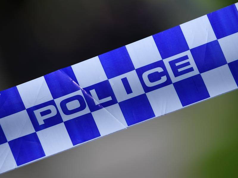 A man has been shot dead after answering a knock at his front door in Canberra.