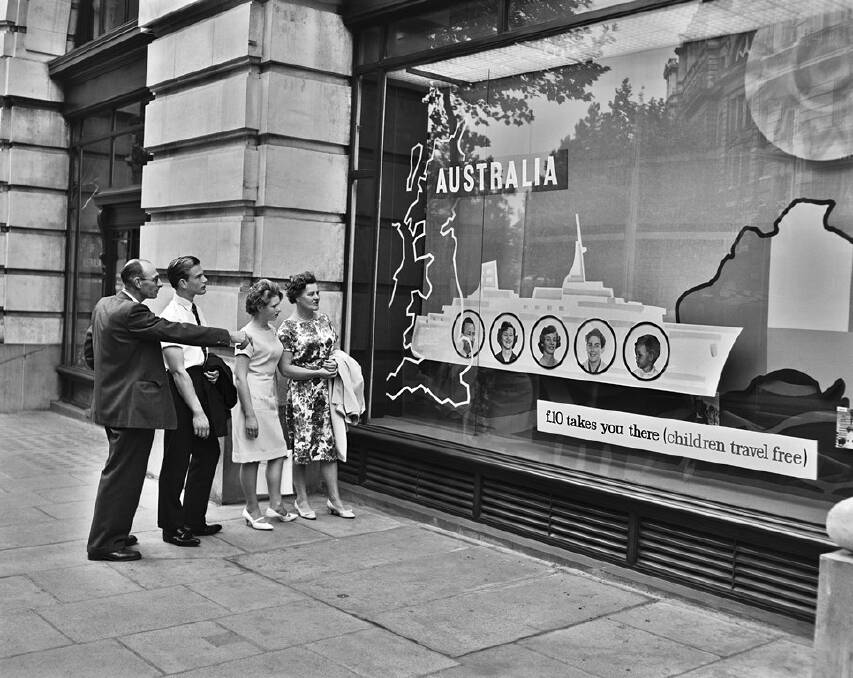ALL ABOARD - Passers-by stop to admire the window display advertising 10 pound passage to Australia at the Department of Immigration offices in London, 1962. Photo: National Archives of Australia.