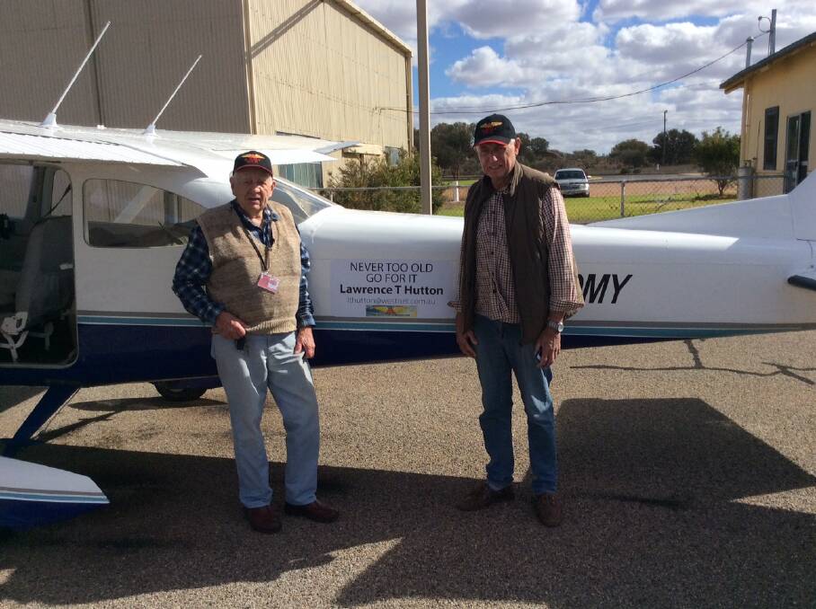UP AND AWAY – Lawrie Hutton (left) with Broken Hill Aero Club president John MacLeod.