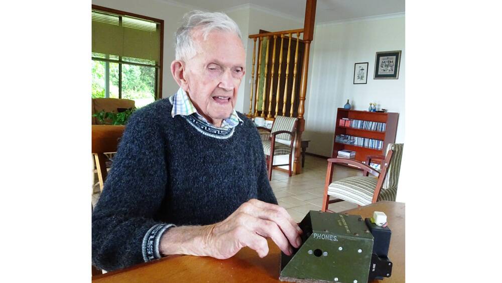 Henry Tranter demonstrates the trusty morse code machine which he used during WWII.