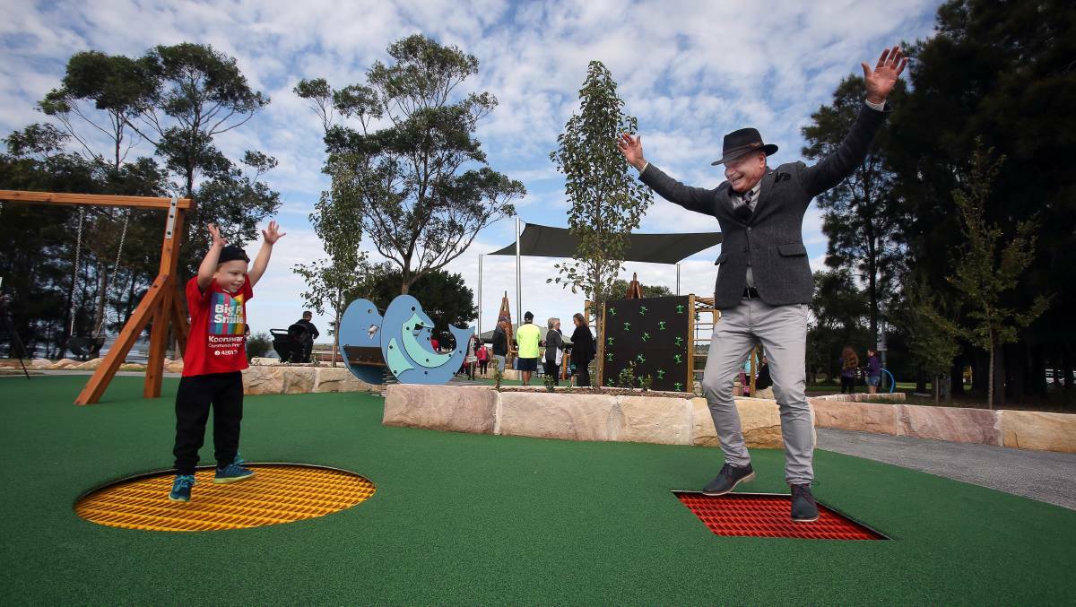 'Strange and weird': Wollongong Lord Mayor Gordon Bradbery - who says he objects to dedicated seniors exercise parks - enjoys a trampoline areas of a children's park in Kanahooka last year. Picture: Robert Peet.