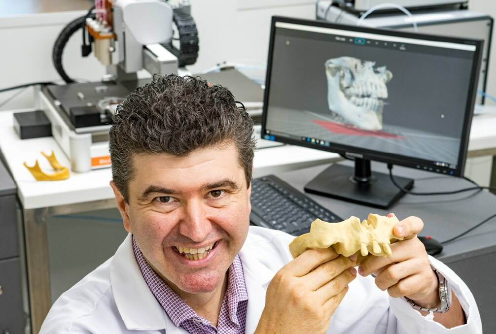 Professor Saso Ivanovski is all smiles at the prospect of using 3D bioprinting to replace missing teeth and bone.