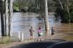 Qld rains ease but flood warnings remain