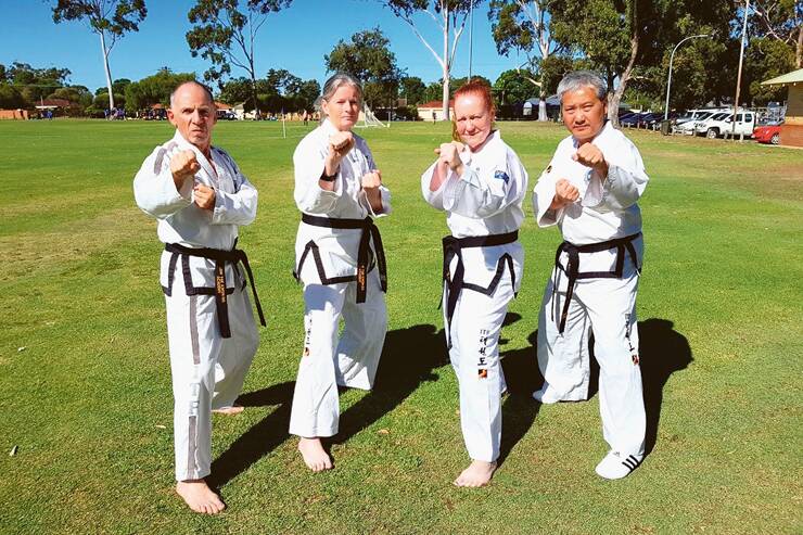 KICK ARTS - Ian Green, Leanne Searle, Pat McQueen and Patrick Ng suited up for taekwon-do. Photo: Low Taekwon-Do Academy