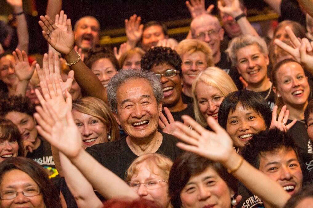 Plenty to smile about – Ji-de Ni (centre) and other participants of the Melbourne With One Voice choir.