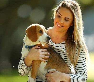 Dog owner and pet-insurance client Lucy Bland with her dog Hudson. Photo: Chris Hyde