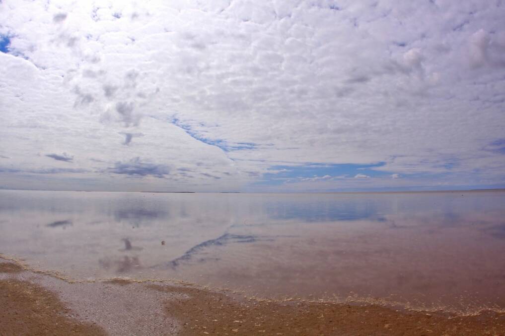 See the glistening waters of magnificent Lake Eyre.