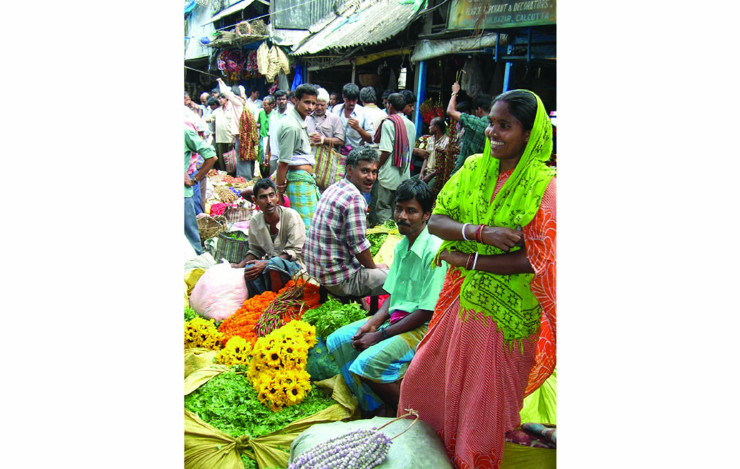 SIGHTS AND SCENTS – A colourful flower market in India.