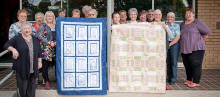 CANCER WRAPPED UP – The Maitland Embroiderers Group with the quilts stitched  to inspire people touched by the disaese. Photo: Perry Duffin