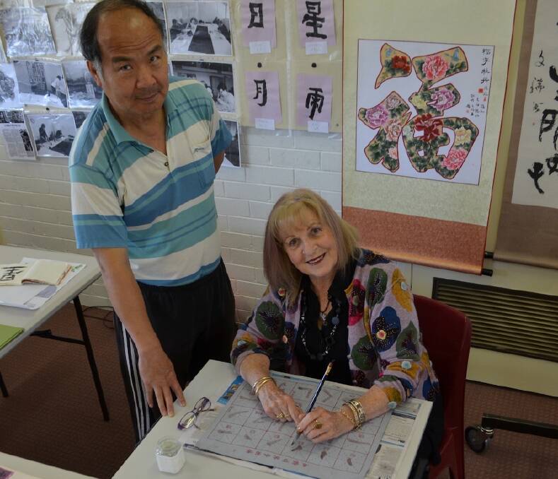Calligraphy creations – Mike Li with his student Beverley Allen.