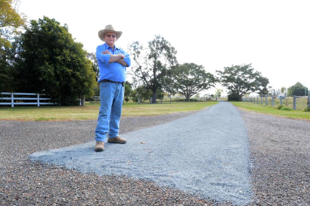 Thomas Ellis with the partially repaired driveway of a Dumeresq Island property. It would cost him $44,000. Photo: Scott Calvin.