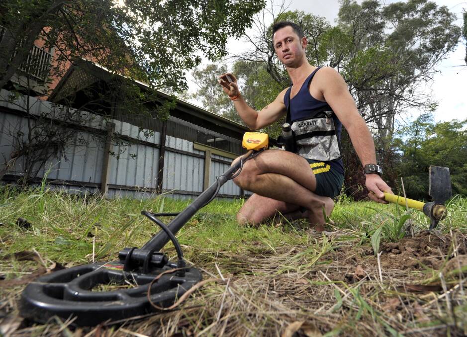 Peter Erbacher uses his metal detector to search Wagga's land. Picture: Les Smith