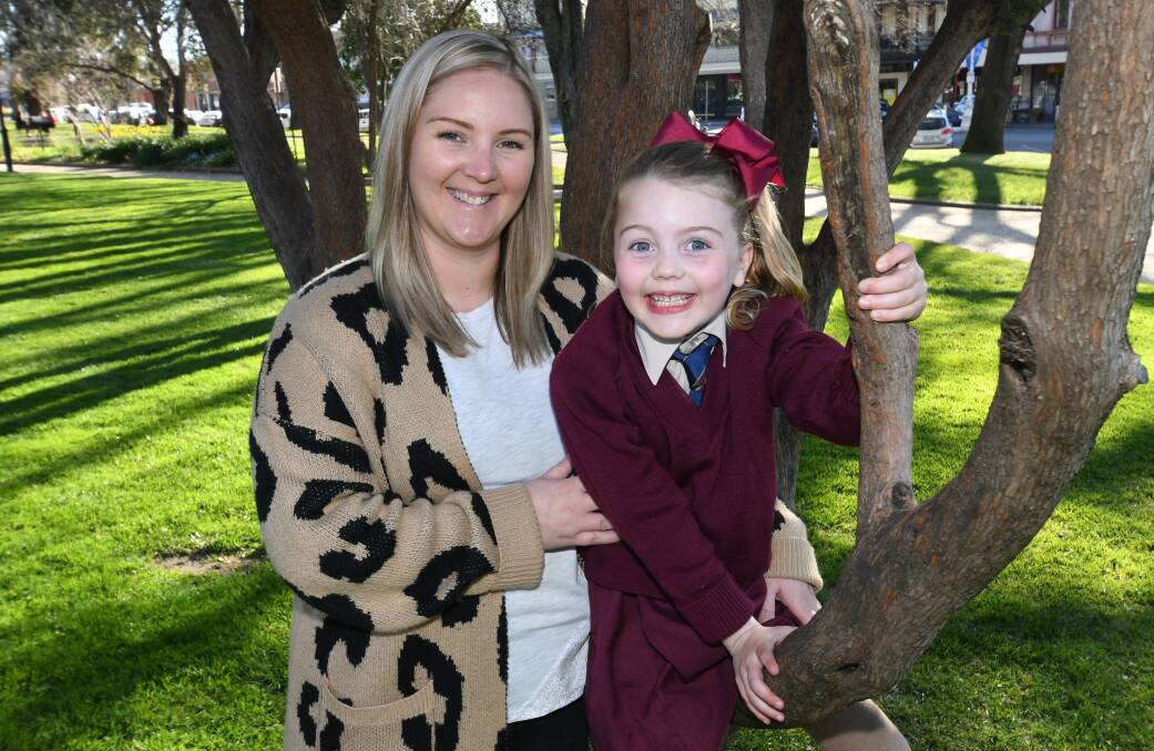 THRIVING: Emma Dennis and her daughter Harper, 6, who had open heart surgery just eight days after she was born. Photo: CHRIS SEABROOK 090120charper