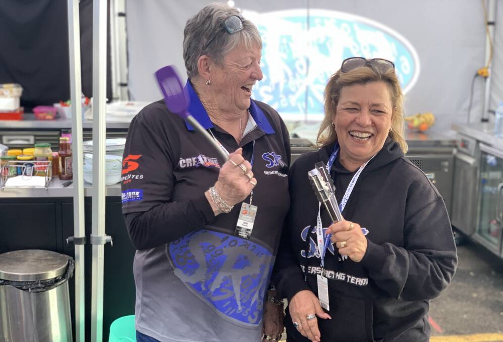 ON THE TOOLS: Sylvia Crupland and Chris Sieders are in the hospitality team for Sieders Racing Team and keep 30 people fed right across the day. Photo: NADINE MORTON 101019nmsieders2