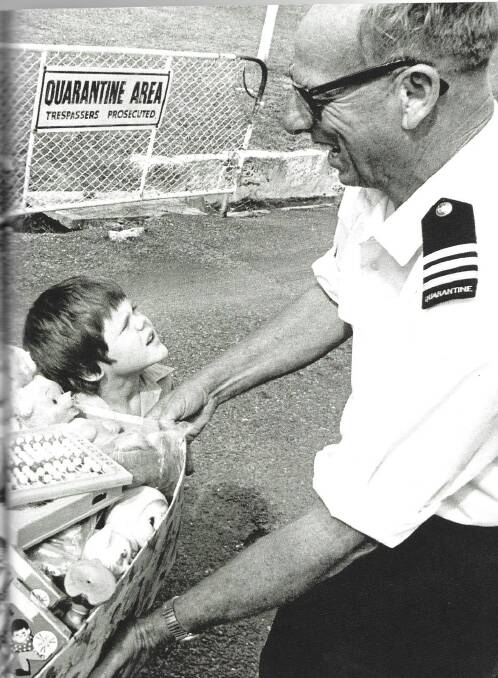 Herbert Lavering at Q Station gate in August 1975 , He was accepting donations of toys from local Manly children on behalf of the Vietnamese orphans who were housed at North Head prior to adoption. The picture was taken by the Manly Daily newspaper.