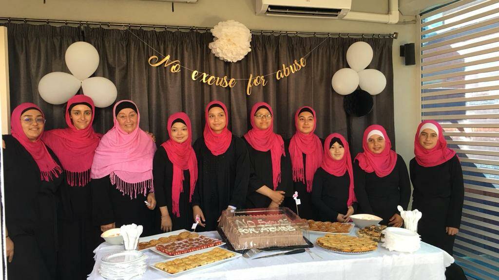 Abla Kadous (third from left) with some of the volunteers from the Islamic Women's Welfare Association at a VIP afternoon tea for No excuse for abuse week.