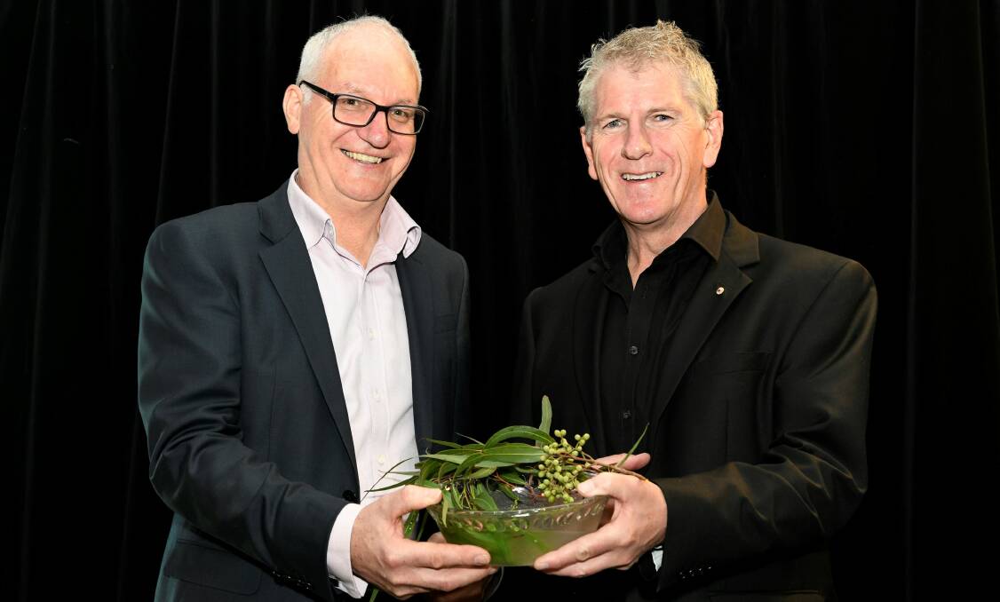 SUPER CENTRE: VincentCare chief executive Quinn Pawson (L) and Father Joe Caddy Episcopal Vicar for Social Services, Melbourne Archdiocese with water used to bless the new Ozanam House homelessness centre. 
