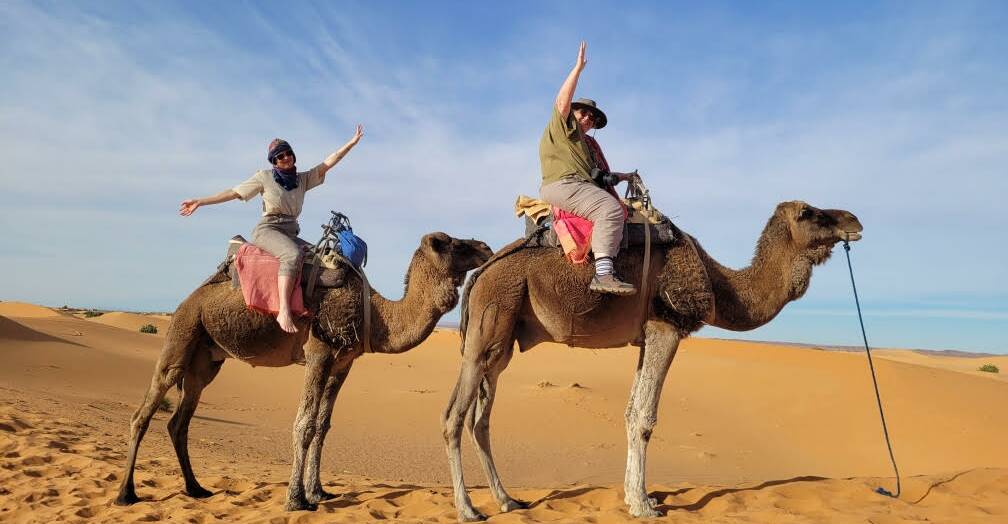 Carol Hucker (right) and niece Olivia get ready for a camel ride in the Sahara. Picture supplied.